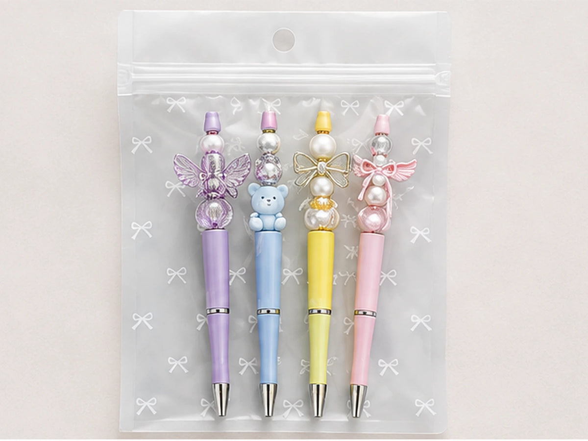 Transparent bow-pattern packaging pouch holding pastel Skyla Studio charm pens